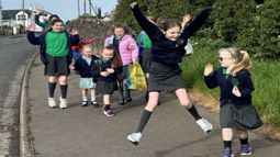 Pupils from Dunseverick Primary, Co Antrim jump for joy at winning the 2026 Big Walk and Wheel