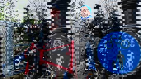 Man and woman using adapted bike on walking and cycling path