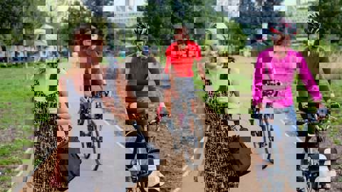 people walking and on bikes using traffic free path