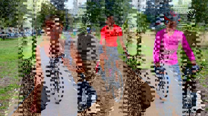 people walking and on bikes using traffic free path