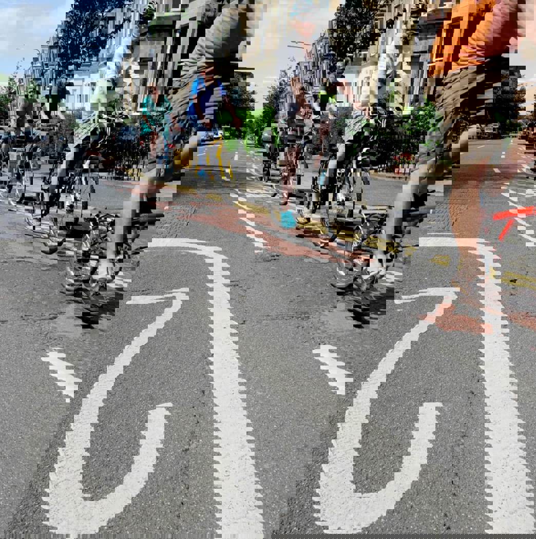 people cycling on 20 mph road