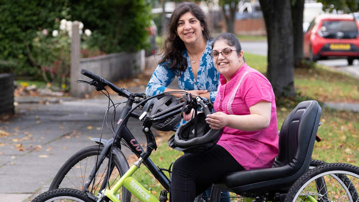 Two people on adapted cycles