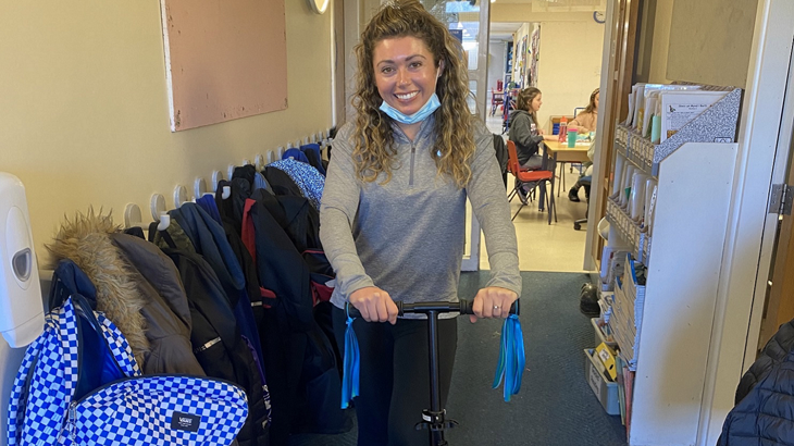 Teacher with commuter adult scooter