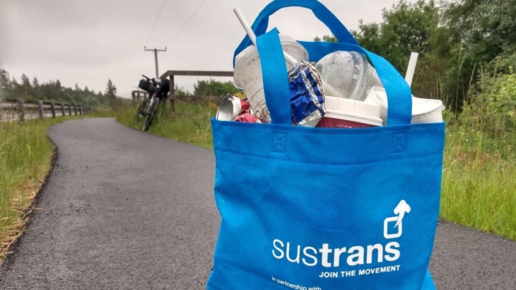 A full Walk Wheel Cycle Trust in Scotland #2MinuteCleanUp bag on National Cycle Network Route 75.