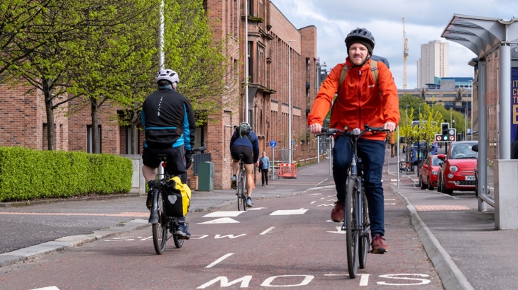 People using the cycle lanes on Gorbals Road in Glasgow.