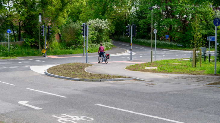 new upgrades to national cycle network route 544, shows improved walking wheeling and cycling infrastructure at a road crossing