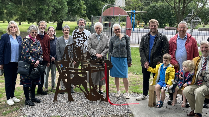 guests gather around brand new portrait bench in Abingdon, Oxfordshire for official unvieling.