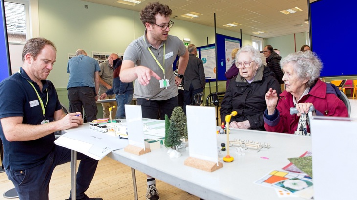 A Walk Wheel Cycle Trust colleague demonstrates how to use the Street Design model kit at an engagement event in Winchburgh