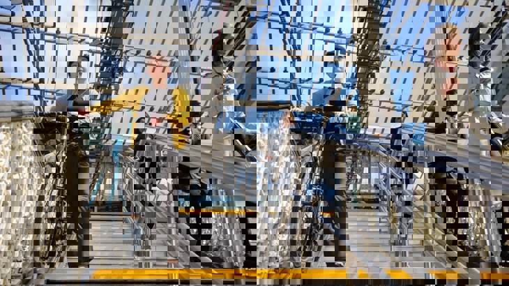 commuter walking bike down the steps at Waverley station