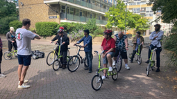 Walk Wheel Cycle Trust staff working with Riverside Hostels customers outdoors.