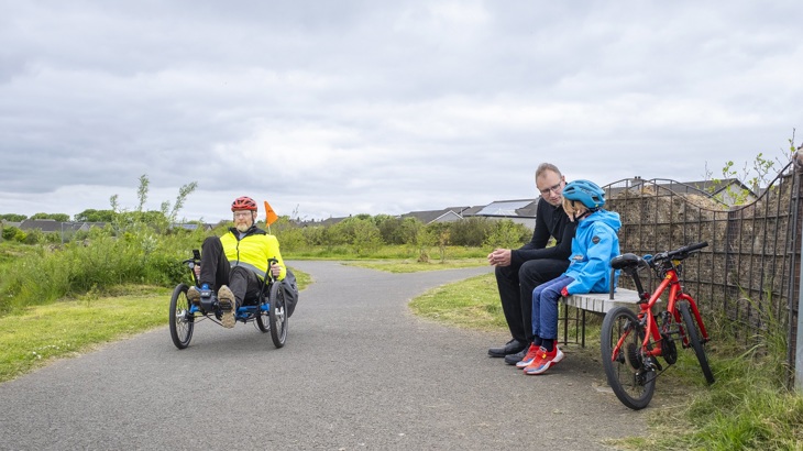 Man using adapted bike in Arcadia Park