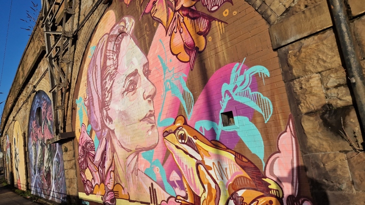 SWG3 Yardworks Festival 2023 received a grant from ArtRoots to commission artists to paint largescale artworks on the railway arches.