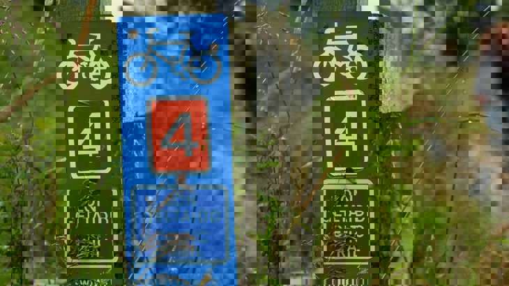 Celtic Trail sign, with two people on cycles, route 4, Wales