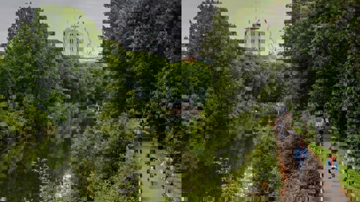 Cyclists on Taff Trail near water