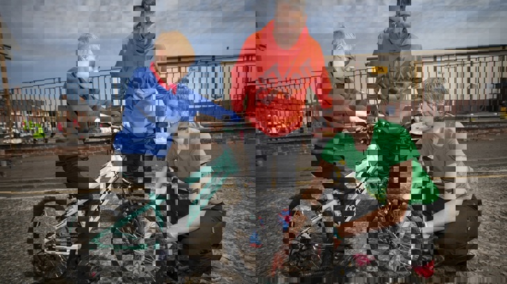 Walk Wheel Cycle Trust schools officer with dad and son on bike