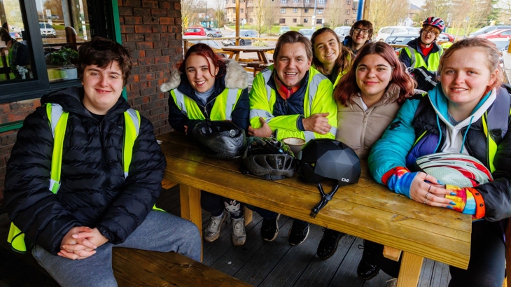 Pupils from Samuel Pepys School sit at table with Mayor of Cambridgeshire and Peterborough Dr Nik Johnson