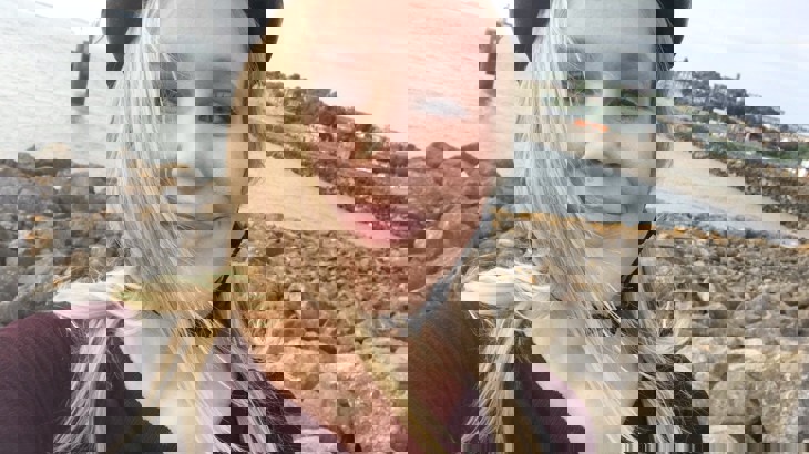 A selfie of Gwyneth by the coast