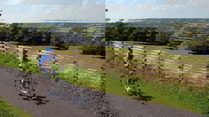 Cyclist on traffic-free path in Wales