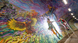 Artist Chris Rutterford painting at the Colinton Tunnel, NCN 75. ArtRoots has supported the Colinton Tunnel project with funding.