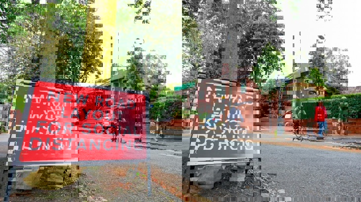 Road sign reading New road layout for social distancing