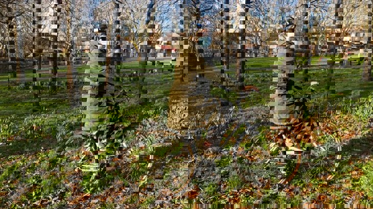 Woman getting onto a bike 