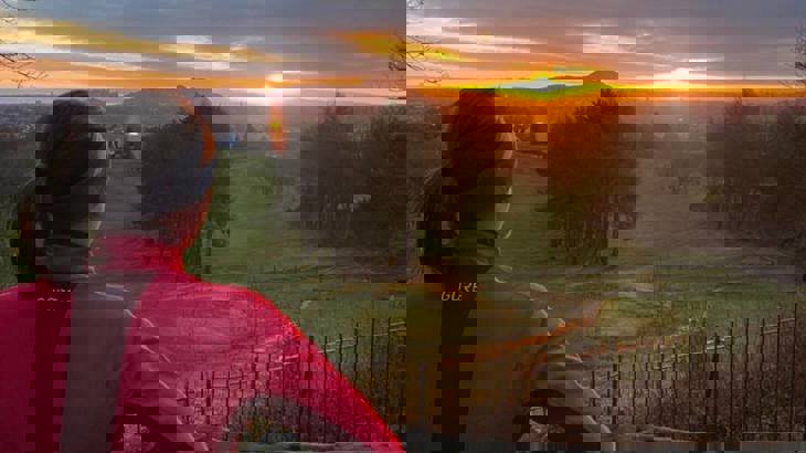 Woman looking at sunset 