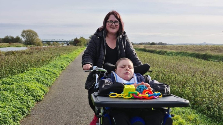 Adam with his carer Gemma on the Water Rail Way, Lincolnshire