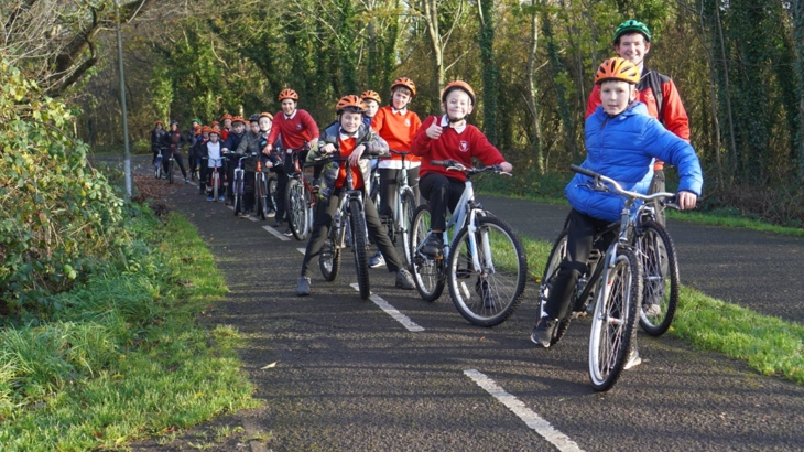 pupils from Tullygally PS cycling on the shared path Craigavon Community Greenway (locally known as the black paths)
