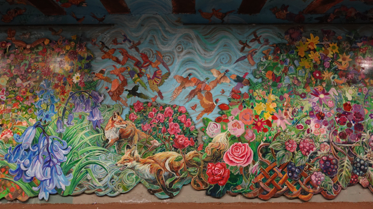 Art mural in the tunnel depicting local wildlife and flowers of Ayrshire. 