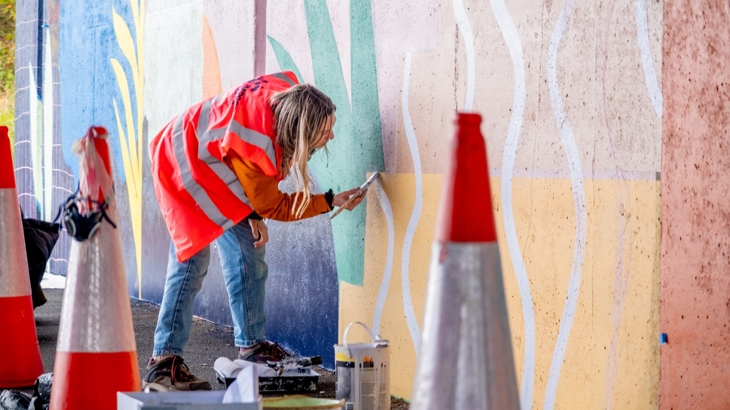 New mural being painted by artist on National Cycle Network Route 7 in Irvine.