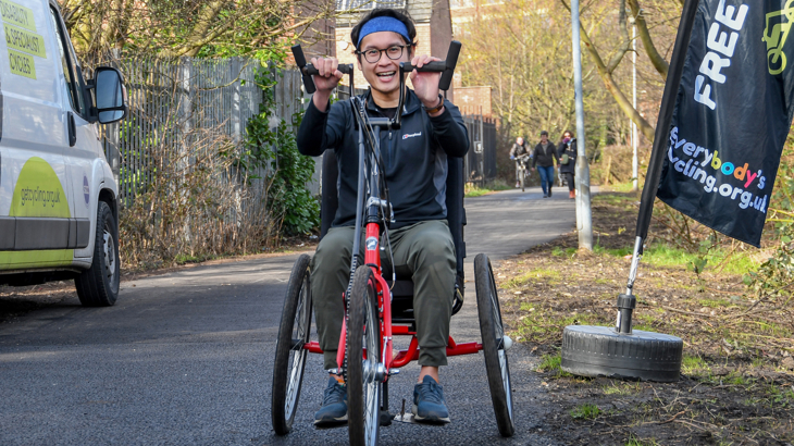 Cyclist on adapted bike on the newly surfaced Foss Islands Path, York. ©2025, David Harrison