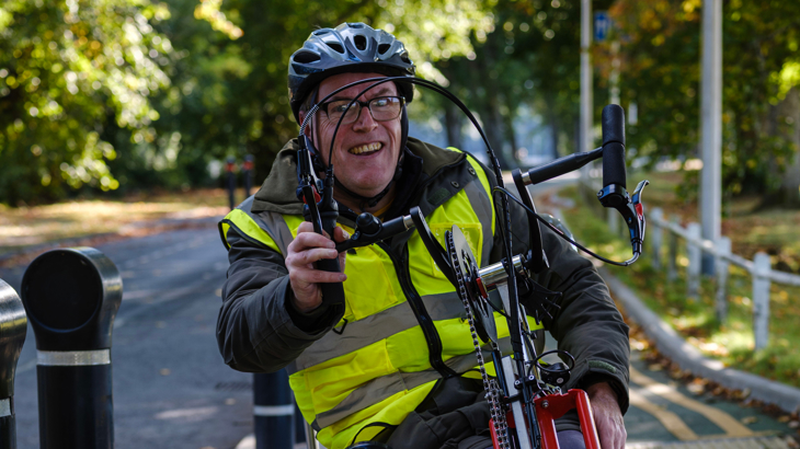 Person on an adaptive bike in Scotland, ©2025, Brian Sweeney