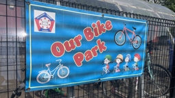 Cycle storage at Ballymena Primary with poster saying 'Our Bike Park'