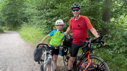 Ian and his daughter Iona stand with their touring bikes on the Avenue Verte cycle path.