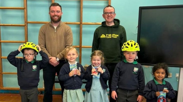 Pupils and staff at Dunseverick Primary School receive prizes for winning the Big Walk and Wheel 2026