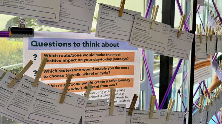Questions and answer sheets filled in during a public engagement event about the local active travel network