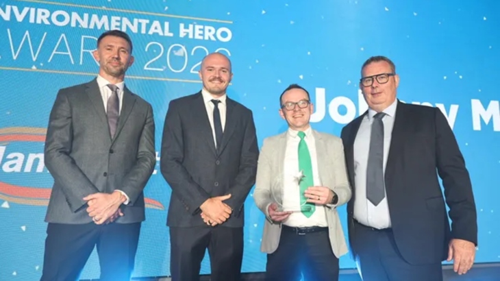 Johnny McCrystal in green tie holding his Environmental Hero award on his right is Ulster rugby star Jacob Stockdale, Irish Rugby hero Gareth McAuley, and sponsor presenter Chris Slowey