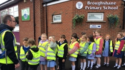 Johnny McCrystal, Project Officer at work with pupils wearing hi-vis from Broughshane Primary in Co Antrim